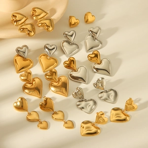 Collection of minimalist gold and silver heart-shaped stainless steel earrings for women