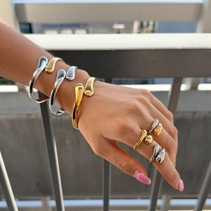 Polished gold and silver stainless steel cuff bracelet and minimalist ring set for women