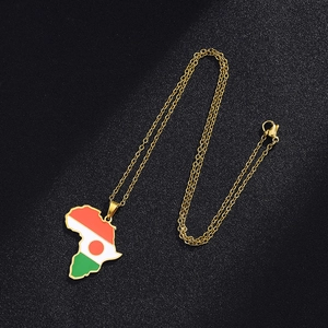 Detailed view of gold Niger map pendant necklace featuring tri-color flag enamel design