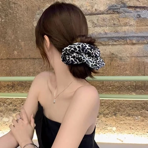 Leopard print scrunchie hair tie on a high ponytail for women with stylish satin texture