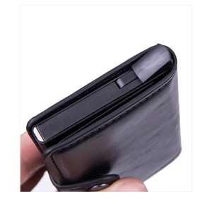 Detail of crazy horse PU leather wallet featuring mechanical pop-up aluminum card holder