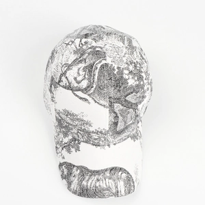Close-up of baseball cap featuring vintage black and white jungle animal Toile de Jouy print