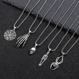 Set of five gothic silver necklaces featuring spider web, skull, and skeletal hand pendants