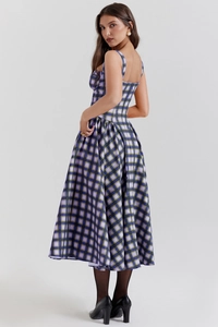 Detail showing the checkered pattern and elegant waist cut of the back of the dress
