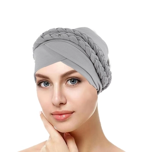 Detail showing the gray braided turban hat featuring an elastic milk silk fabric texture