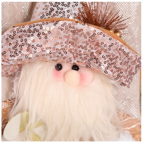 Close-up of Santa doll with rose gold sequin hat and soft white plush beard decoration