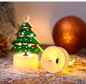 Close-up of LED Christmas tree candle light showing base switch and festive snow details