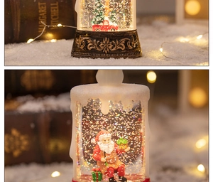 Macro detail of LED Christmas candle lamp featuring Santa and reindeer inside the water globe