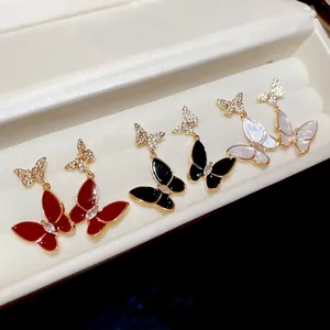 Elegant gold butterfly drop earrings with cubic zirconia and colorful enamel accents