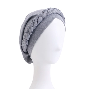 Close-up of the knitted texture and braided twist detail on the grey headscarf hat