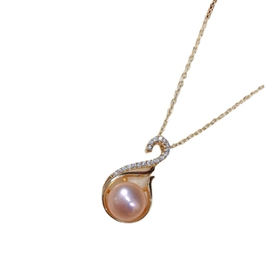 Elegant gold swan pendant necklace featuring a soft pink pearl and sparkling zircon accents