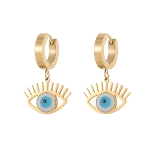 Detail of gold evil eye earrings with blue opal center and eyelash frame on white background