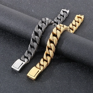 Detail of 15mm Cuban chain bracelet showing intricate dot-pattern textures and buckle closure