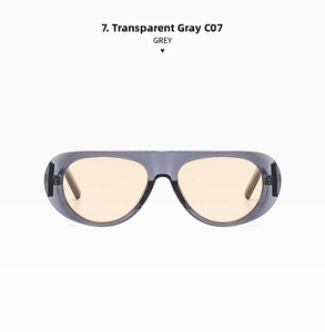 Detail view of transparent grey pilot sunglasses with clear orange lenses and C07 hinges