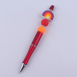 Detail of DIY beadable pen with rainbow silicone topper and rhinestone spacers