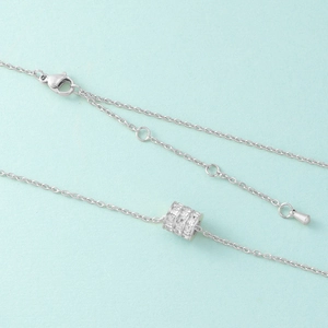 Silver titanium steel necklace featuring a sparkling full diamond cylinder pendant on blue base