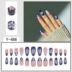 Blue almond fake nails with 3D floral design and elegant gradient french tip finish