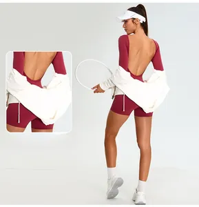 Detailed back view of long-sleeve backless yoga bodysuit in burgundy with fitted design