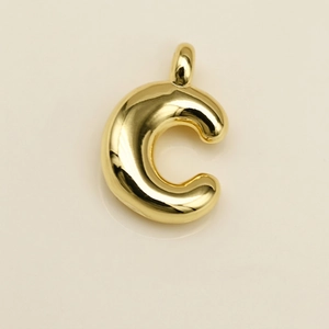 Polished gold 3D bubble letter C pendant with reflective mirror finish and integrated loop
