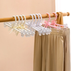 Elegant pearl pants hanger set with silk bow decoration in white and pink colors