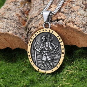 Detail of Saint Christopher oval pendant with gold edge on natural bark background