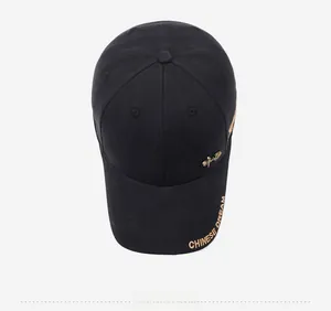 Top view of black cotton baseball cap with golden Chinese Dream embroidery and metal buckle