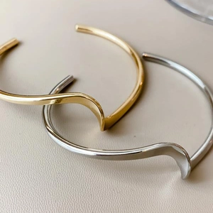 Minimalist polished wavy open cuff bracelet in gold and silver finish for women