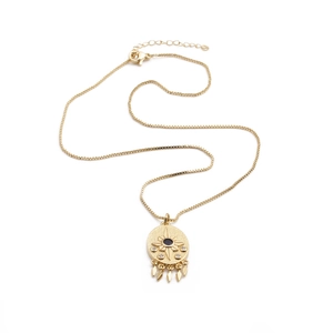 Gold plated evil eye necklace with starburst pendant and diamond tassels on box chain
