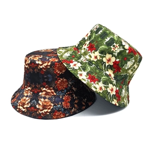 Floral print bucket hats in tropical and vintage styles for sun protection outdoors