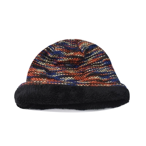 Detailed view of winter knit beanie featuring colorful wavy pattern and soft fleece lining
