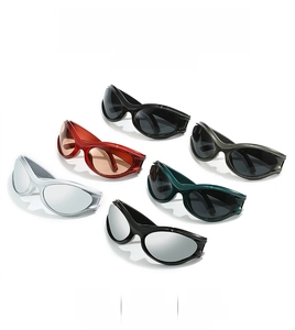 Collection of Y2K futuristic oversized sunglasses in various colors with streamlined frames