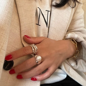 Korean style 925 sterling silver twisted ring worn by a model in casual chic attire