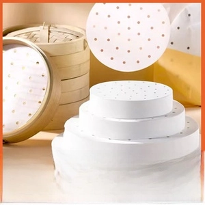 Close-up of perforated non-stick silicone steaming papers for round bamboo baskets