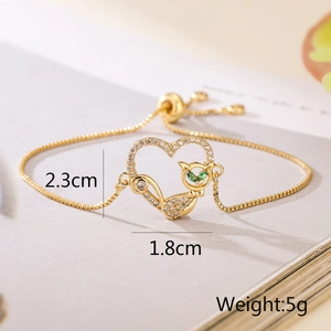 Macro view of gold cat heart bracelet dimensions 2.3cm by 1.8cm and 5g weight