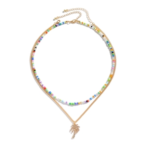 Double-layer necklace with colorful seed beads and gold chain with palm tree pendant