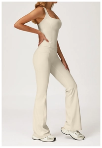 Detail view of cream yoga set showing racerback top and flared leggings with side pockets