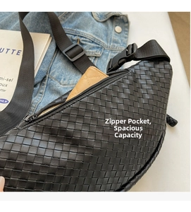 Close-up of woven leather crossbody bag showing internal capacity and metal zipper detail