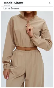 Detail of latte brown windproof hooded jacket and wide-leg sports pants set
