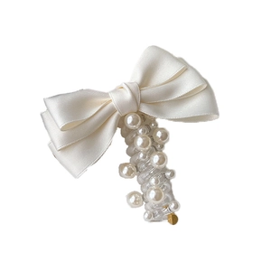Elegant off-white satin bow hair tie with pearls and transparent spiral cord design