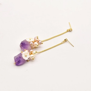 Vintage freshwater pearl and amethyst tassel earrings with shell flower details in gold