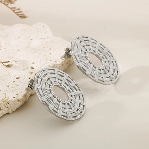 Detailed view of silver woven texture on these oval stainless steel earrings