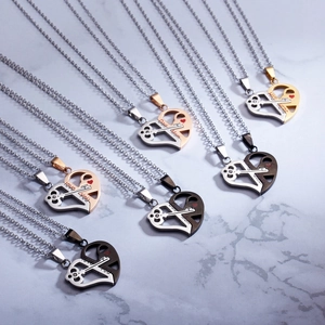 Detail of stainless steel heart and key puzzle necklaces for couples in gold and silver