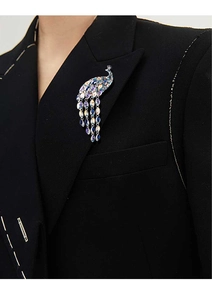 Exquisite crystal peacock brooch with colorful rhinestones on a black suit lapel