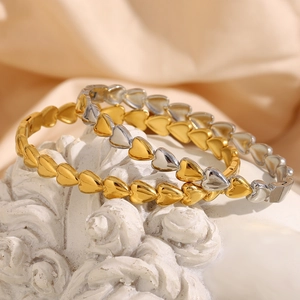 Minimalist 18K gold plated heart buckle bracelet with polished metal finish on rose relief
