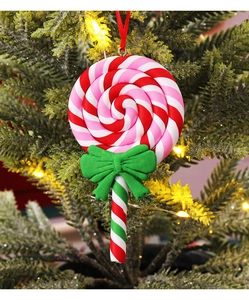 Close-up of a colorful clay swirl lollipop Christmas tree ornament with a red bow tie