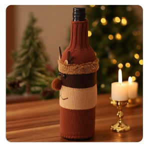 Detailed close-up of knitted Christmas reindeer wine bottle cover in festive setting