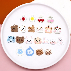 Close-up of assorted DIY frosted matte animal and fruit alloy charms for jewelry