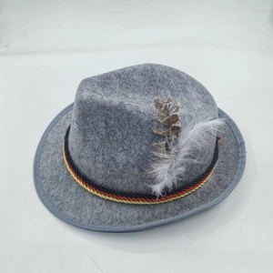 Macro shot of grey wool felt fedora with German tricolor braided rope and striped feathers