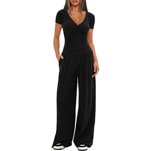 Detailed view of women's black two-piece set featuring V-neck short sleeve top and wide leg pants
