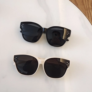 Chic TR90 polarized sunglasses for kids in black and beige with classic metal rivets